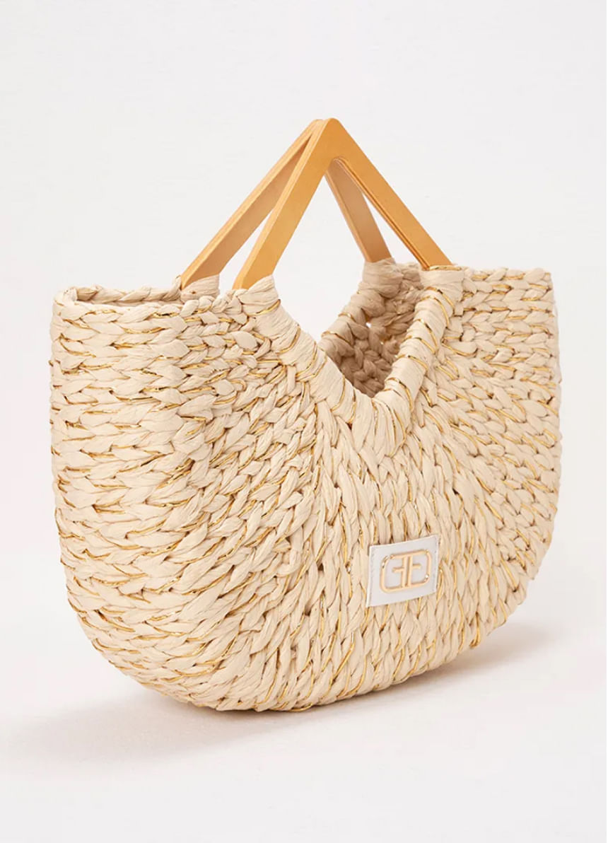Foto de bolsa para mujer en material orgánico con asas de madera